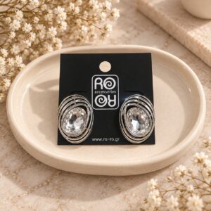 RO Accessories Crystal Oval ασημί οβάλ σκουλαρίκια με μεγάλη διάφανη πέτρα και περίτεχνες μεταλλικές καμπύλες.