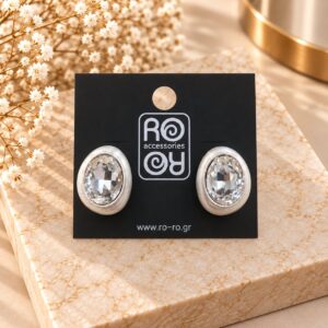 RO Accessories Crystal Oval Elegance ασημί οβάλ σκουλαρίκια με μεγάλη διάφανη πολυεδρική πέτρα και σατινέ ασημί περίγραμμα.